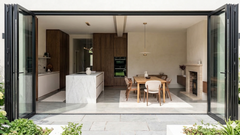 Completed open-plan kitchen and dining room extension with bi-fold doors in the North West.